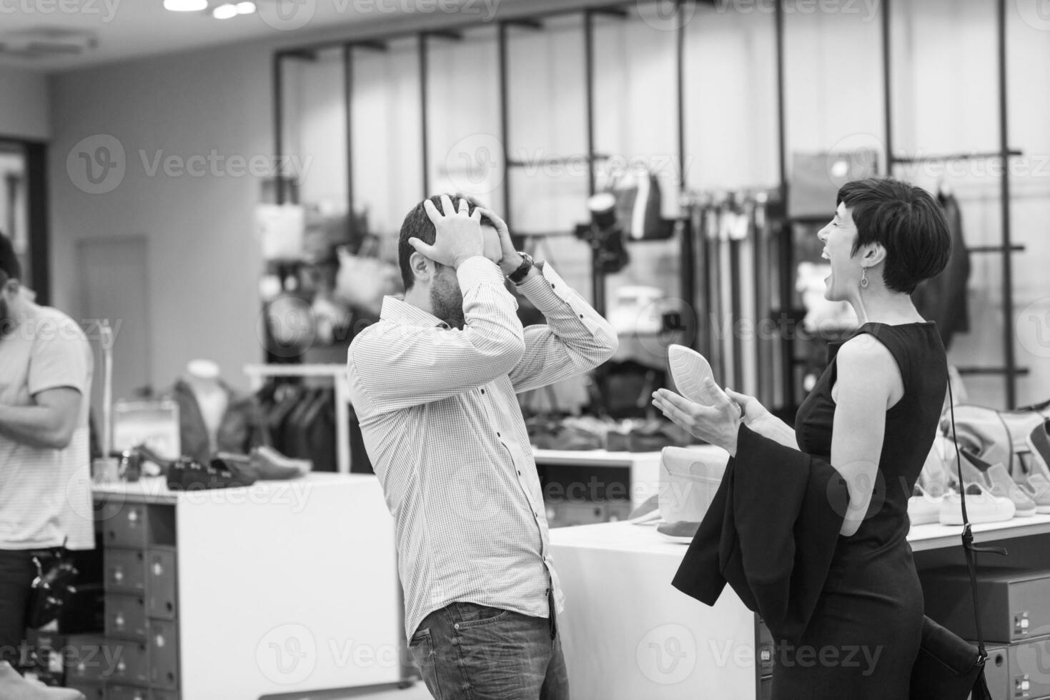 couple chooses shoes At Shoe Store photo