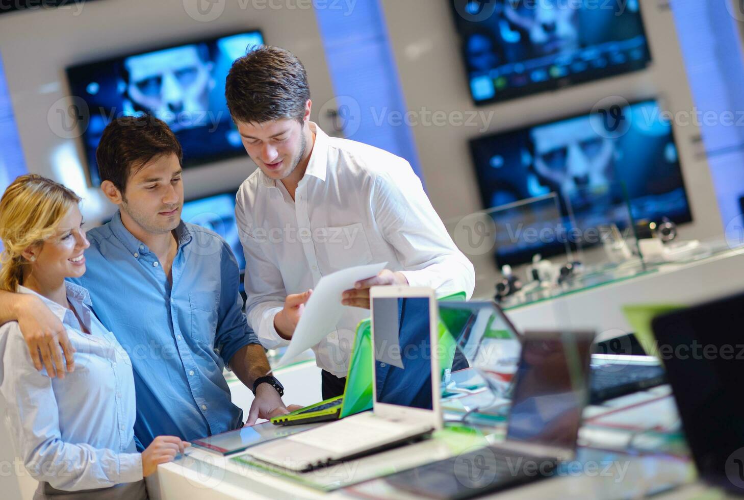 people buy  in consumer electronics store photo