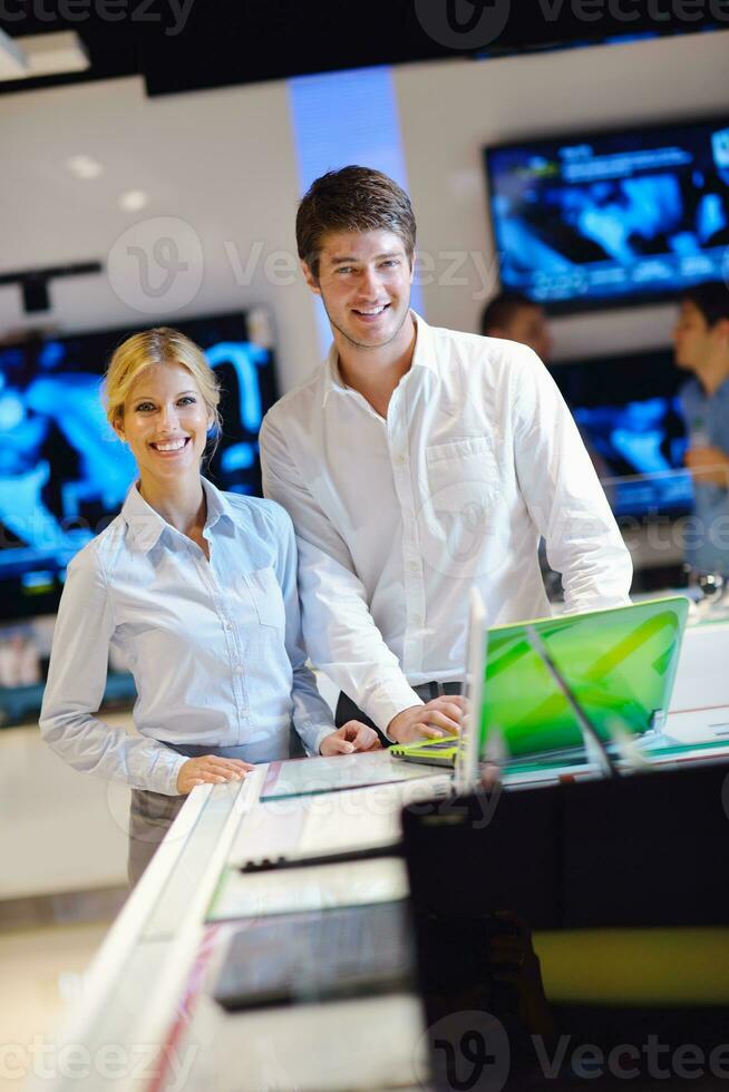 people buy  in consumer electronics store photo