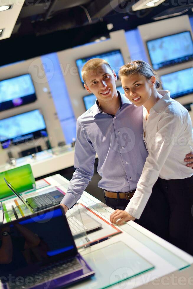 people buy  in consumer electronics store photo