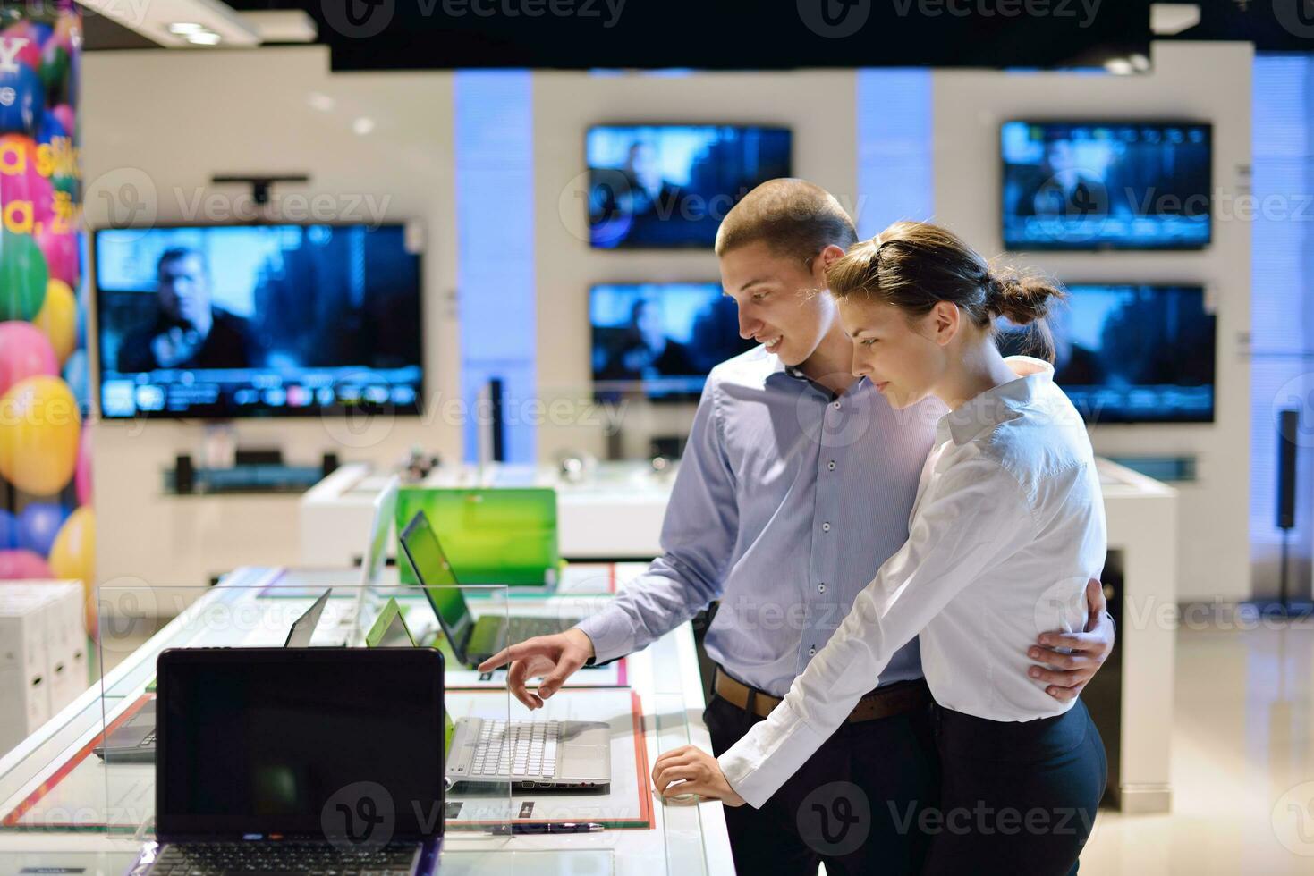 Young couple in consumer electronics store photo