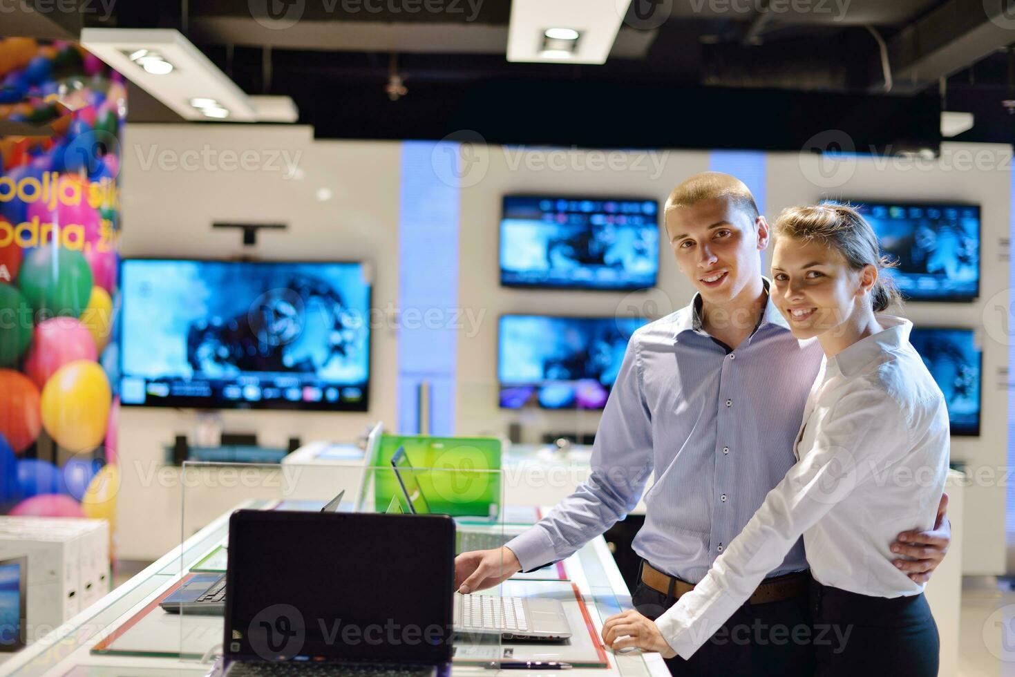 Young couple in consumer electronics store photo