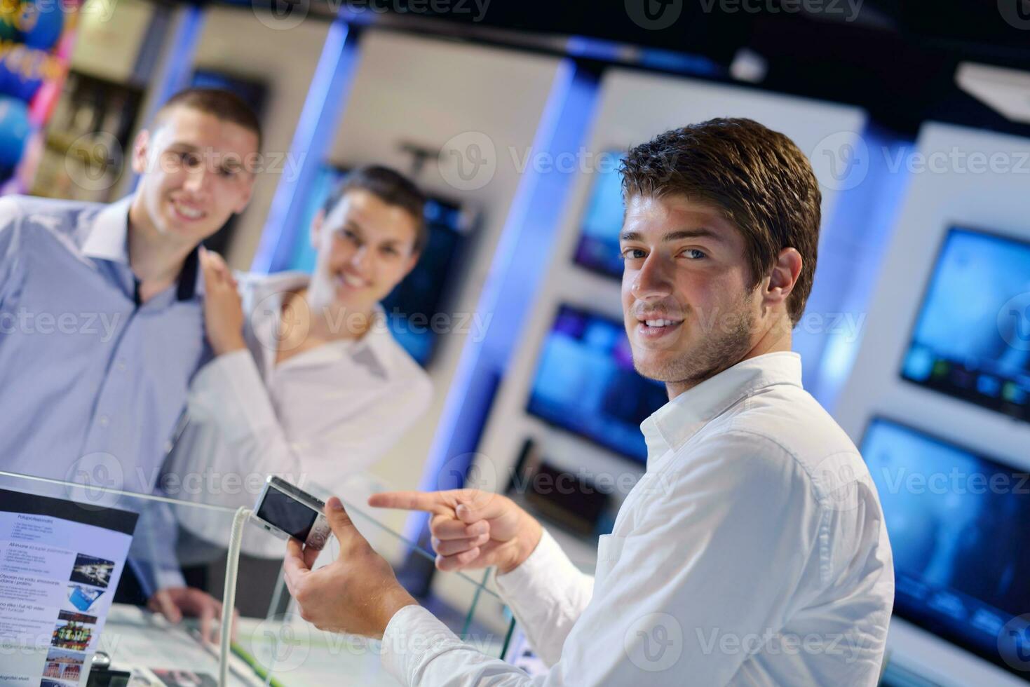 people buy  in consumer electronics store photo
