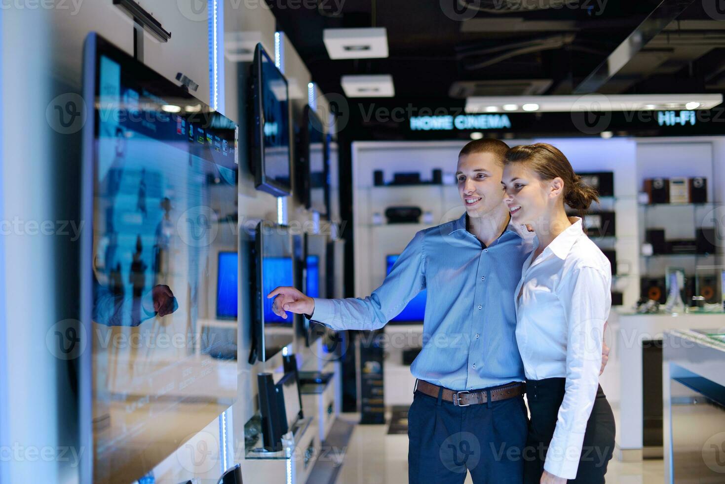 Young couple in consumer electronics store photo