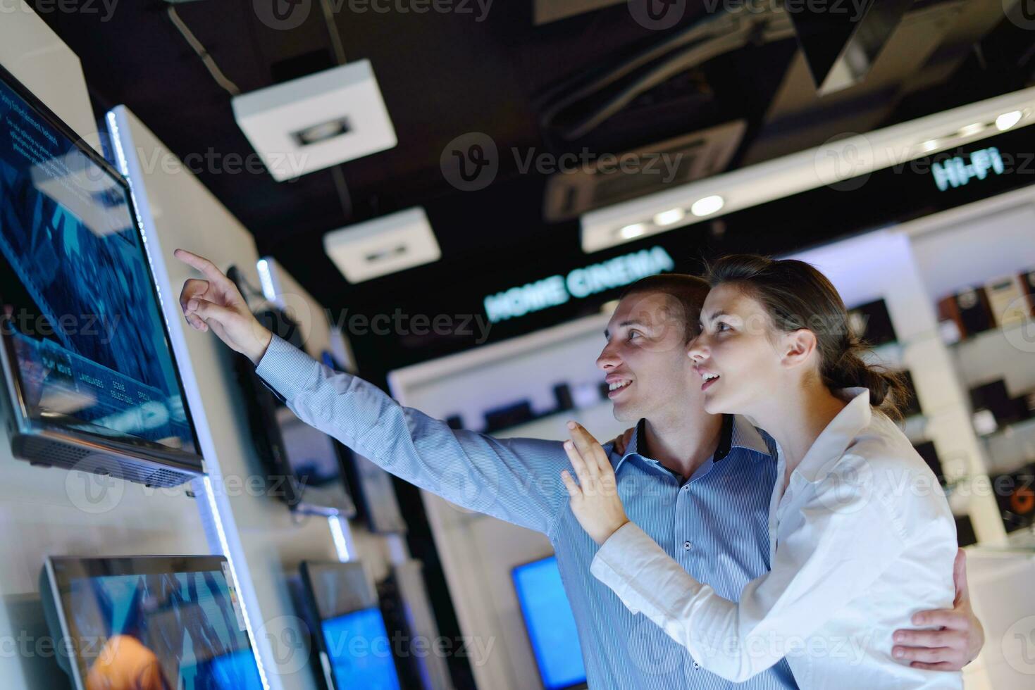 Young couple in consumer electronics store photo