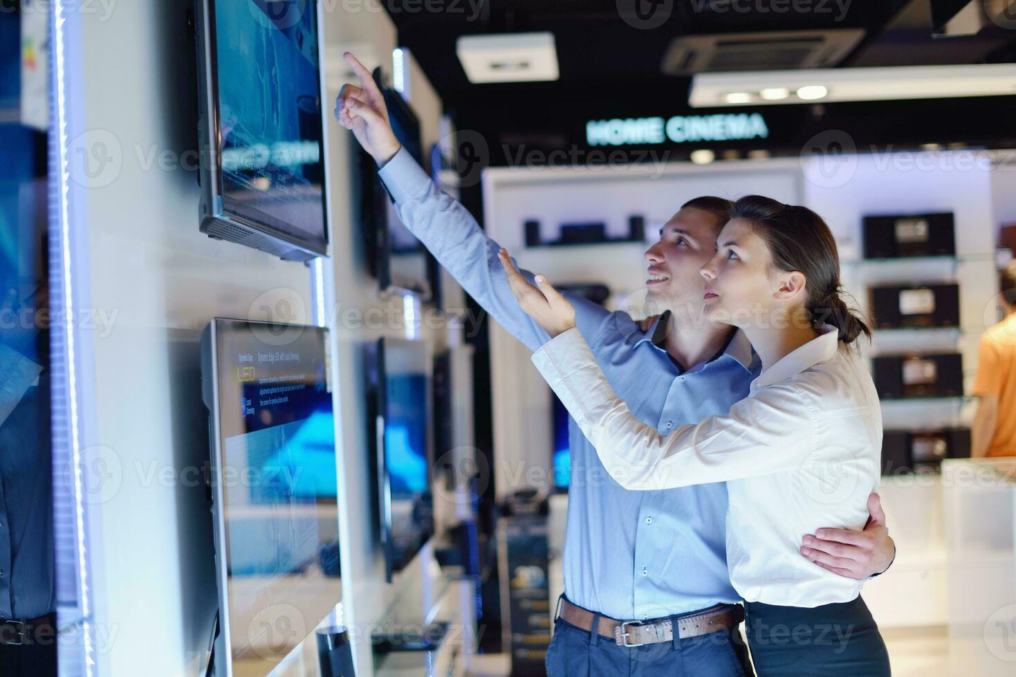 people buy  in consumer electronics store photo