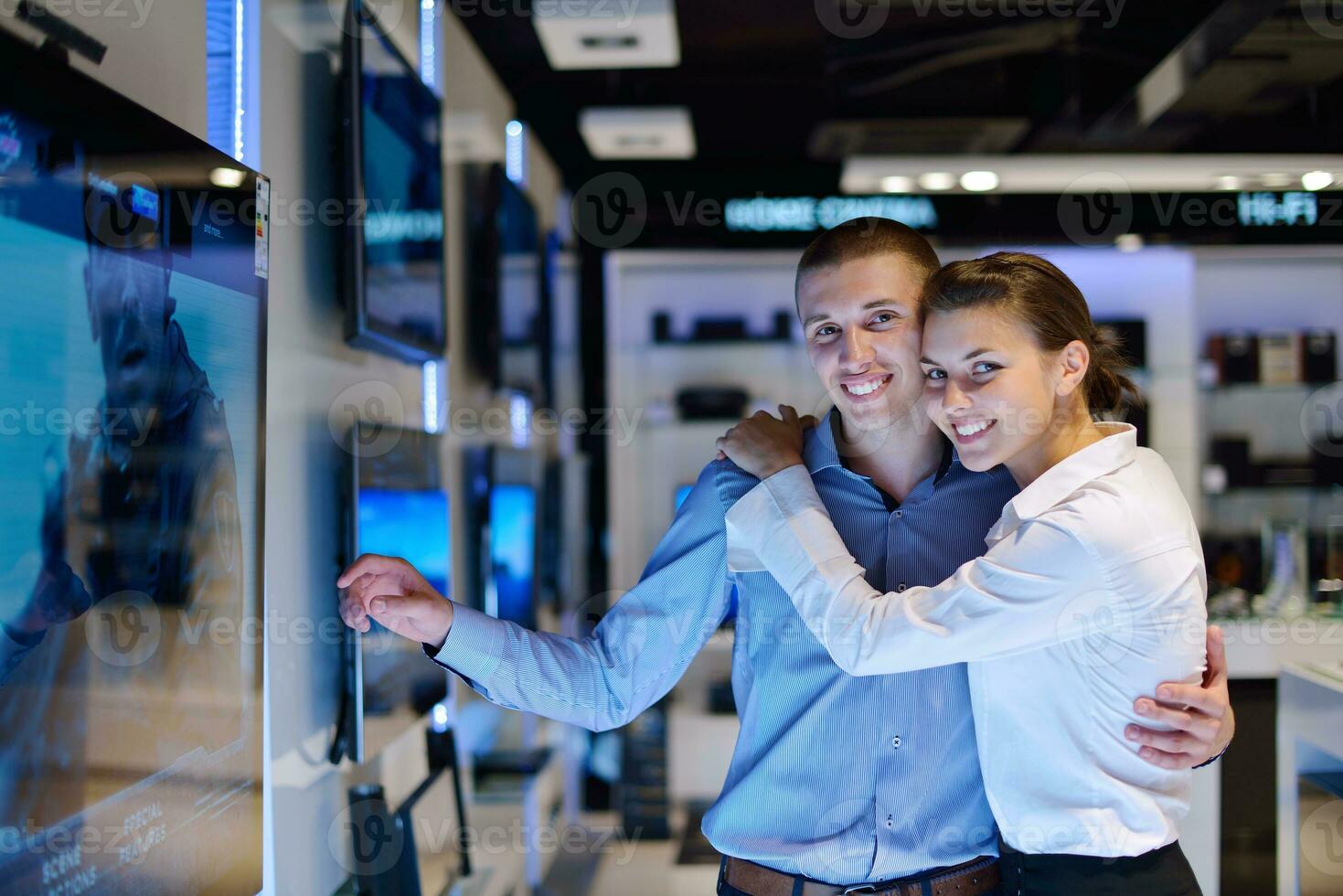 Young couple in consumer electronics store photo