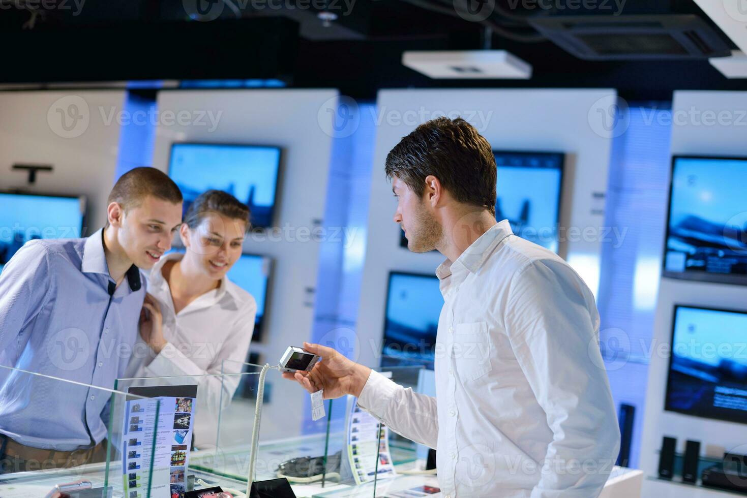 Young couple in consumer electronics store photo