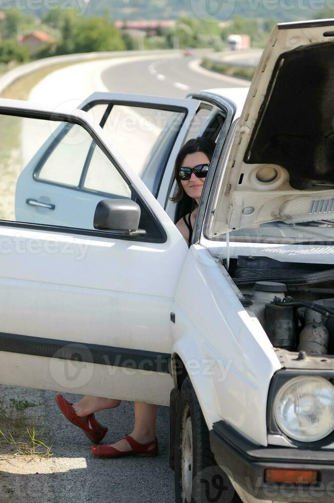 Young woman waiting in car photo