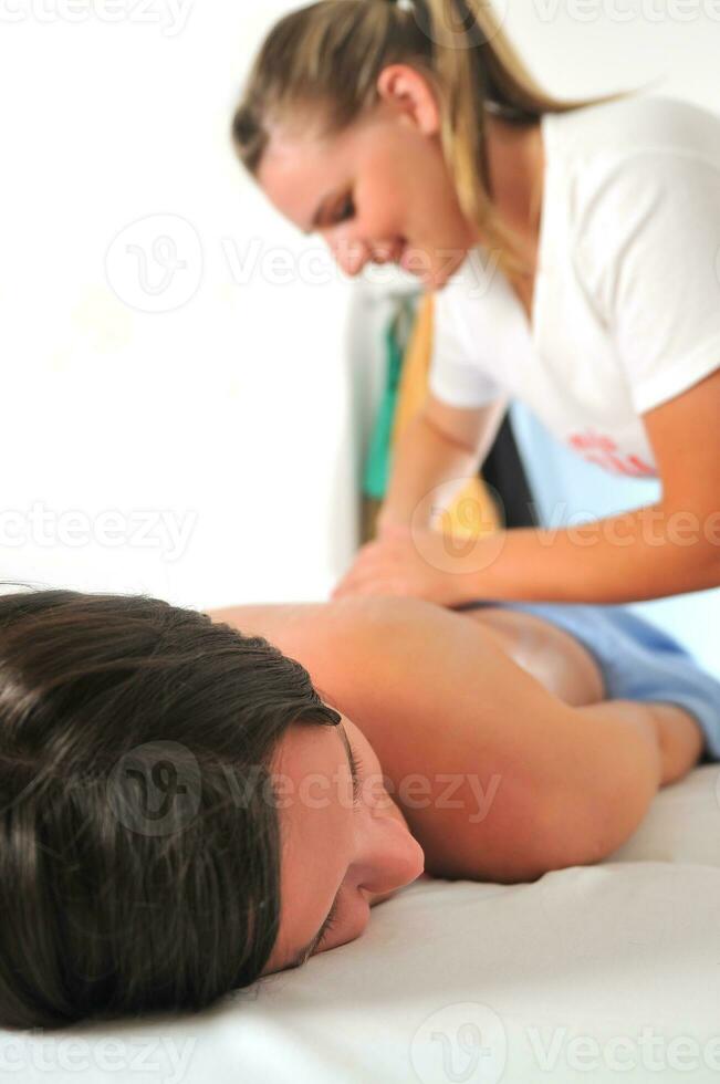 back massage at the spa and wellness center photo