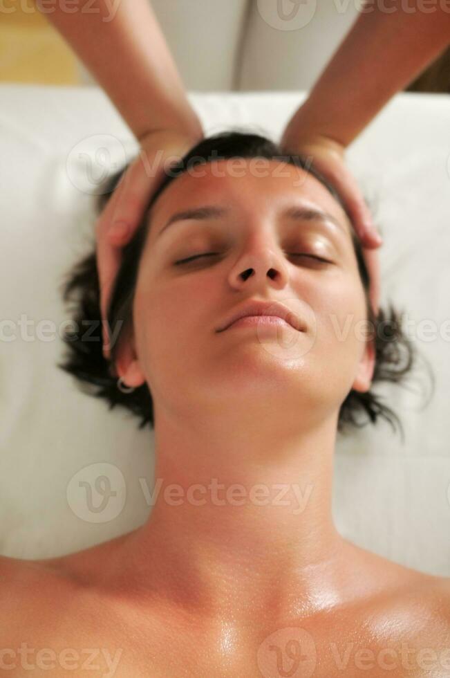 beautiful woman have massage at spa and wellness center photo