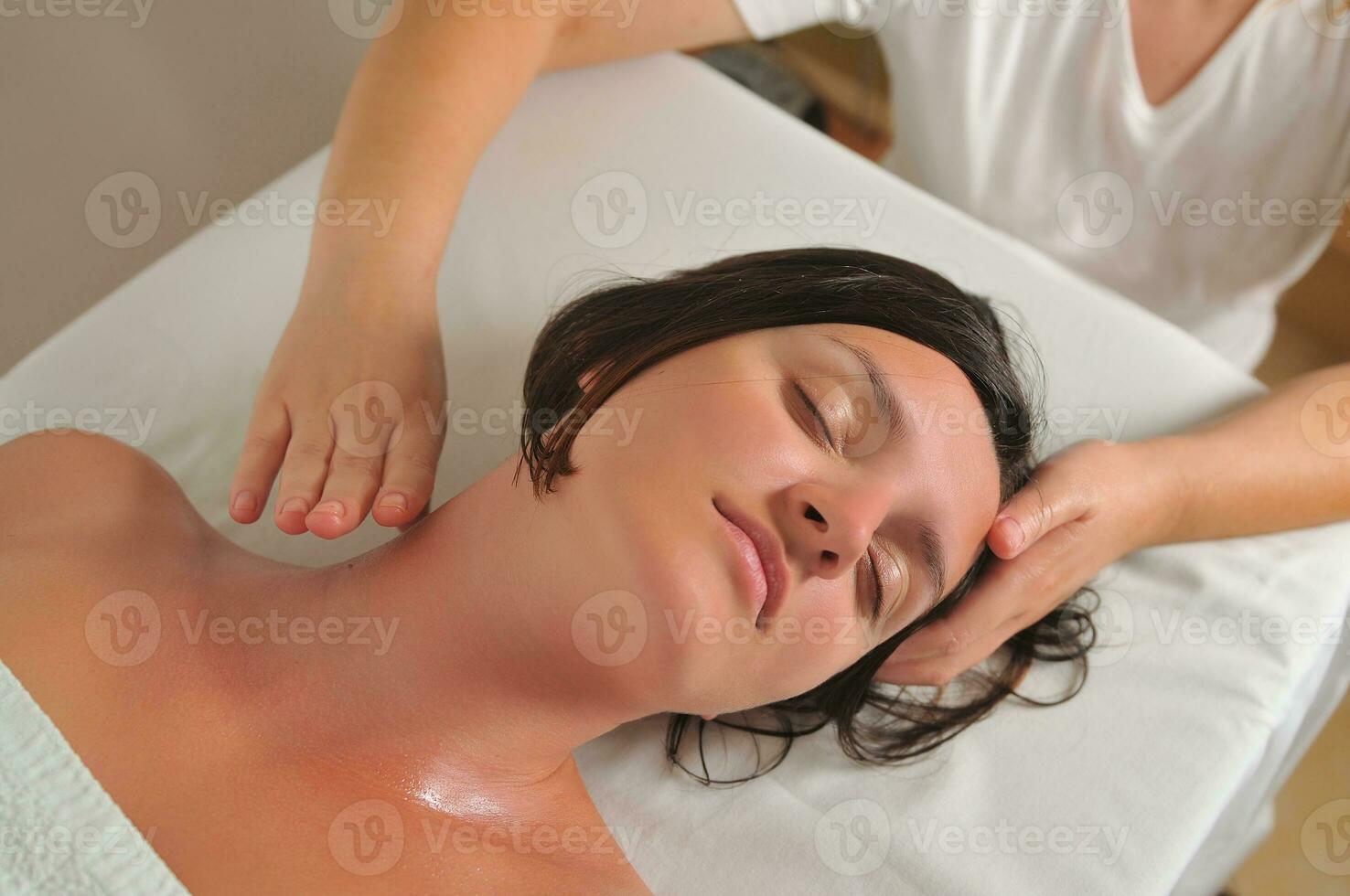 beautiful woman have massage at spa and wellness center photo