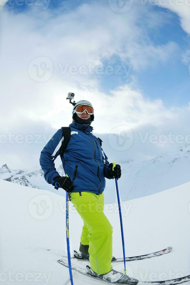 skiing on fresh snow at winter season at beautiful sunny day photo