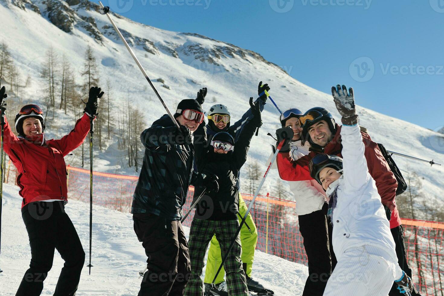 winter portrait of friends at skiing photo
