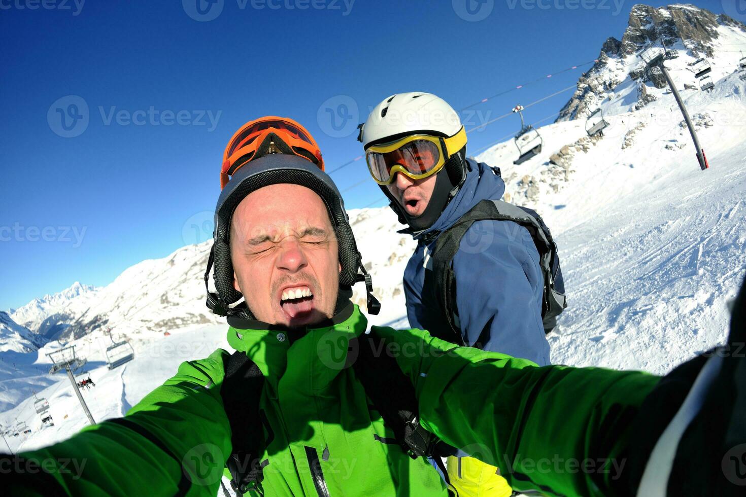 winter portrait of friends at skiing photo