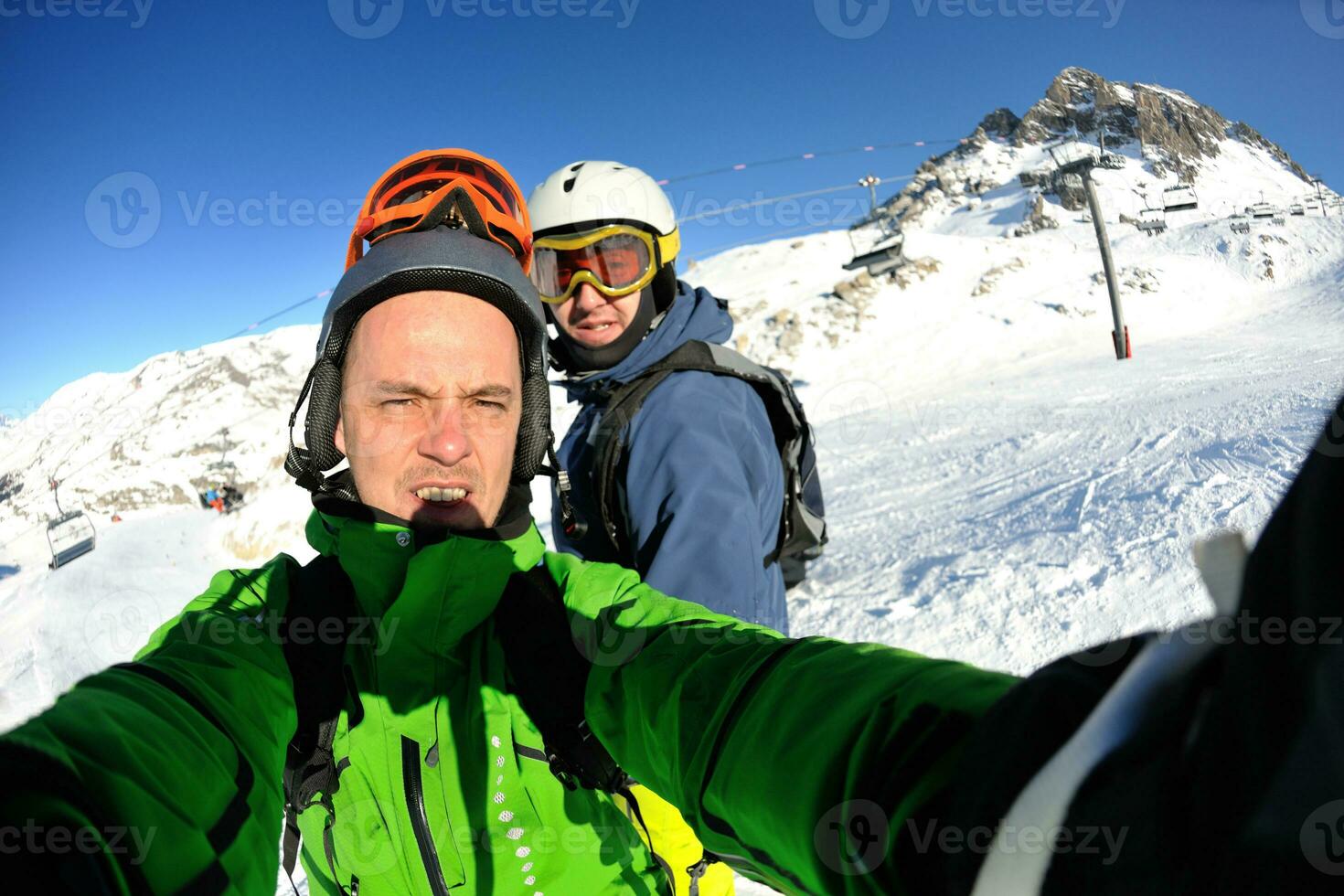 winter portrait of friends at skiing photo