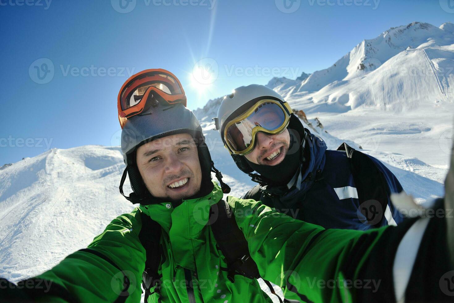 winter portrait of friends at skiing photo