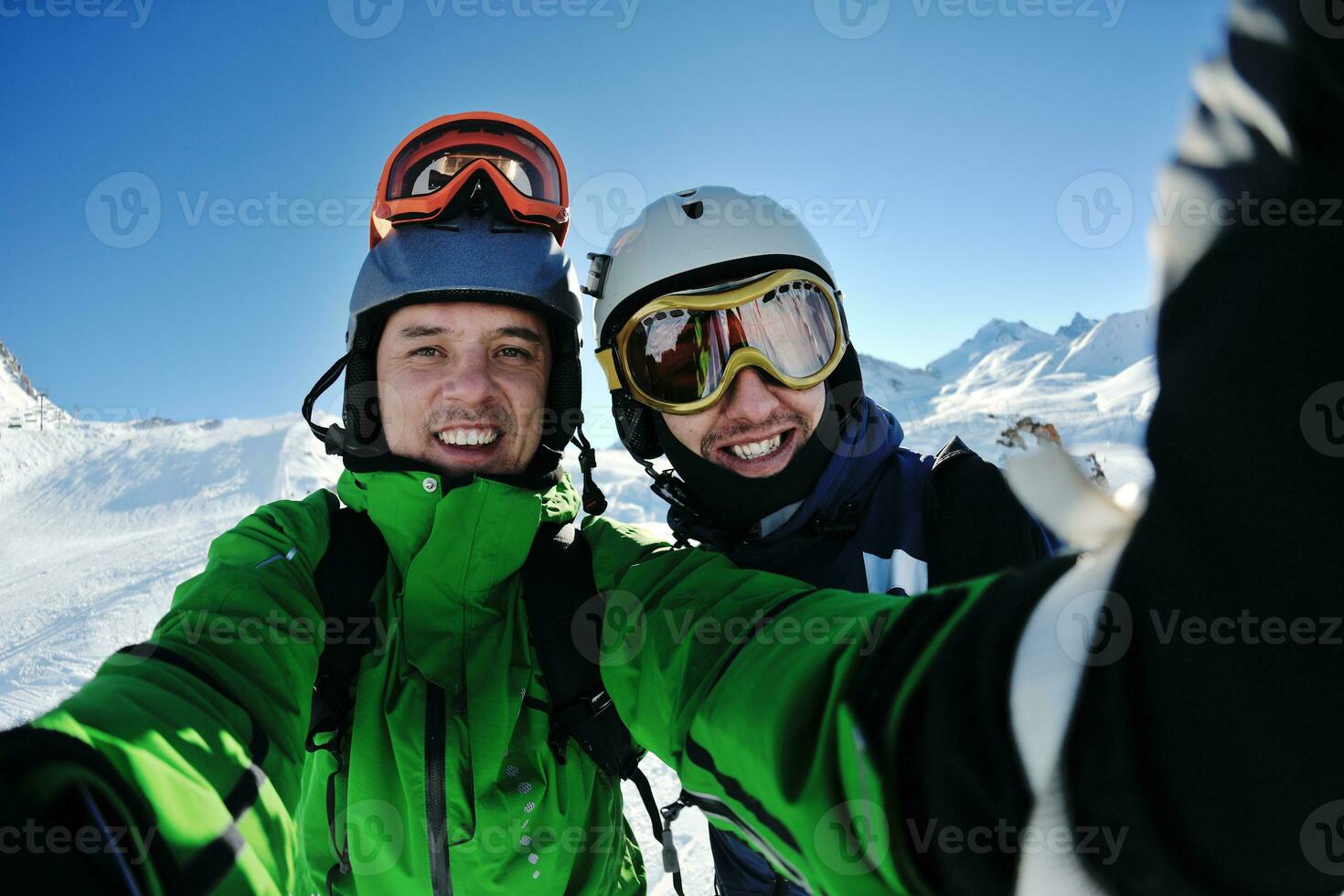 winter portrait of friends at skiing photo