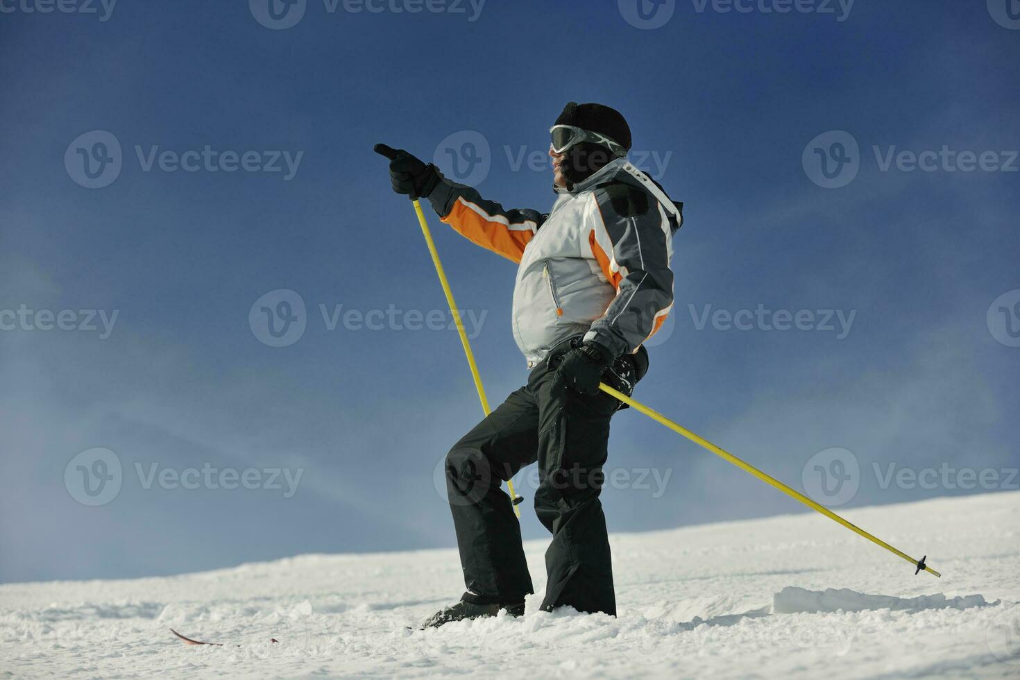 skier pointing direction photo