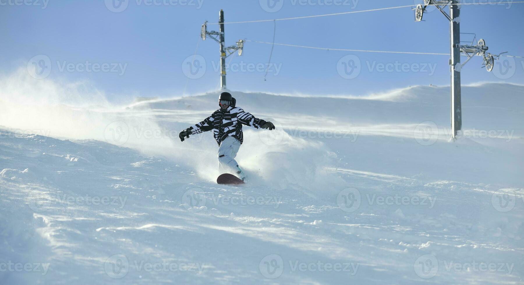 freestyle snowboarder jump and ride photo