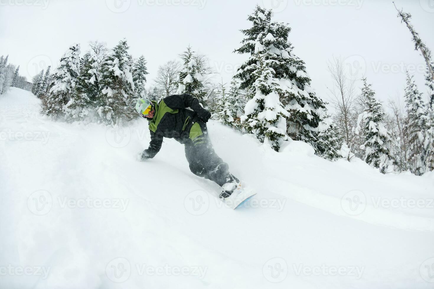 snowboarder on fresh deep snow photo