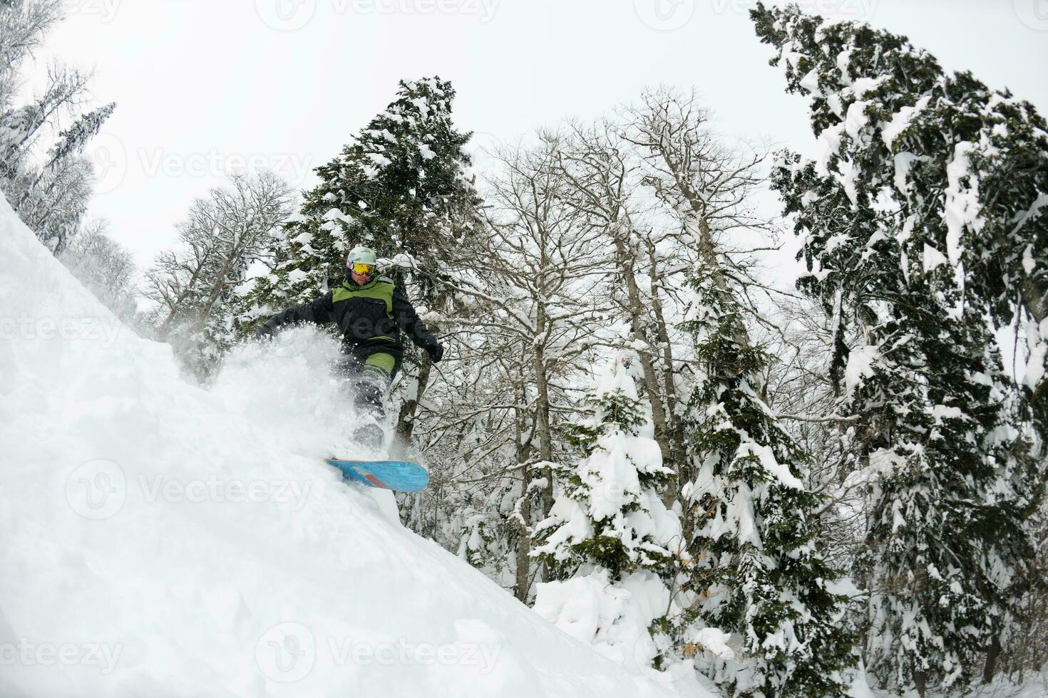 snowboarder on fresh deep snow photo