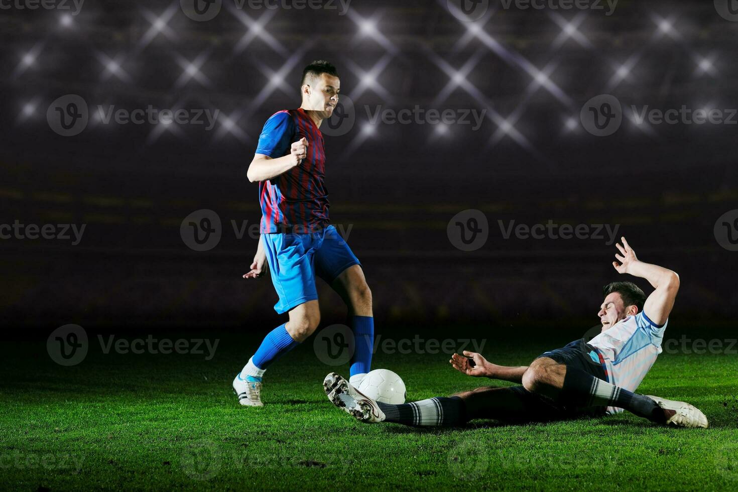 football players in competition for the ball photo