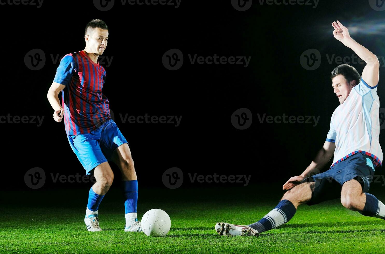 football players in competition for the ball photo