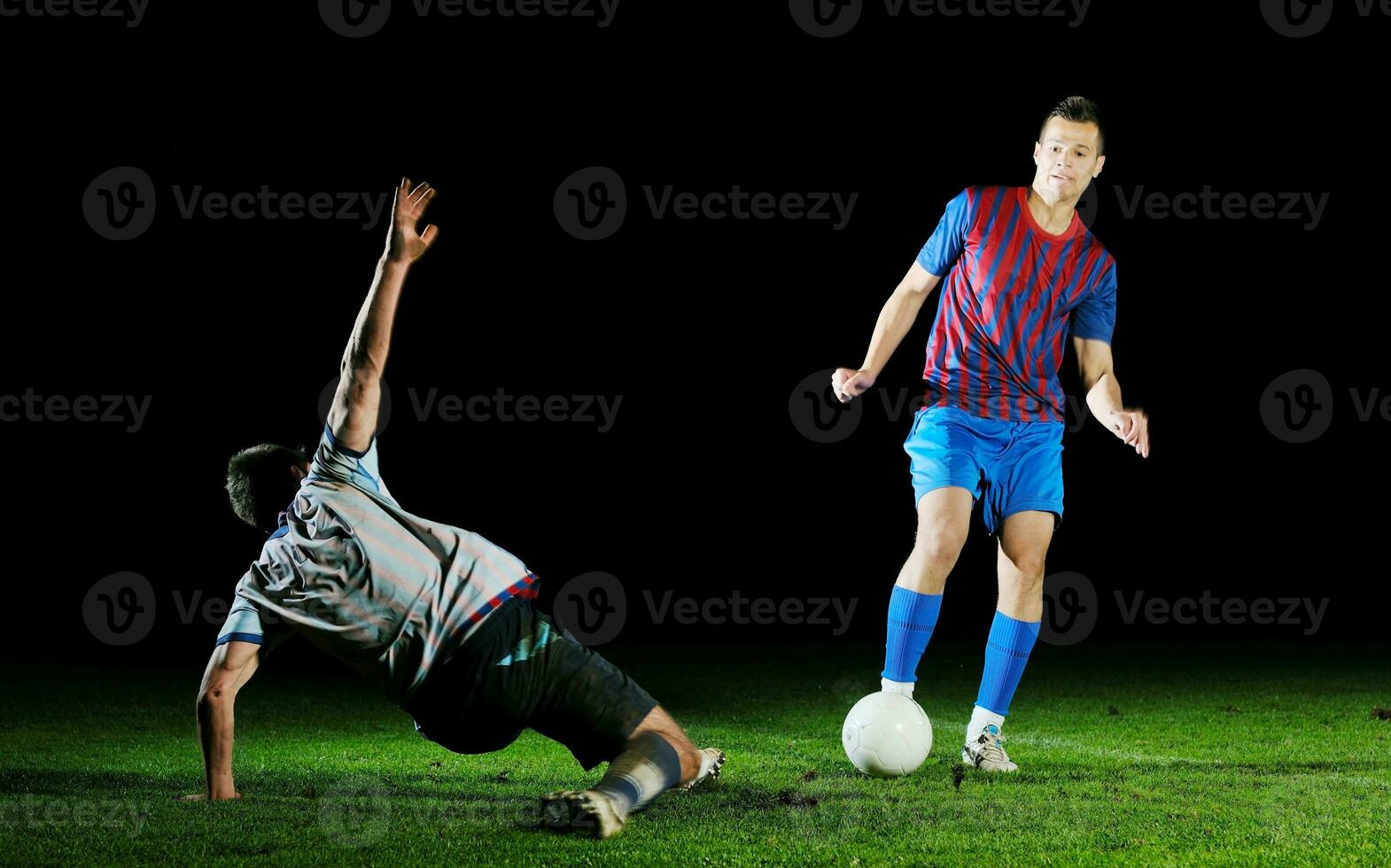 football players in competition for the ball photo