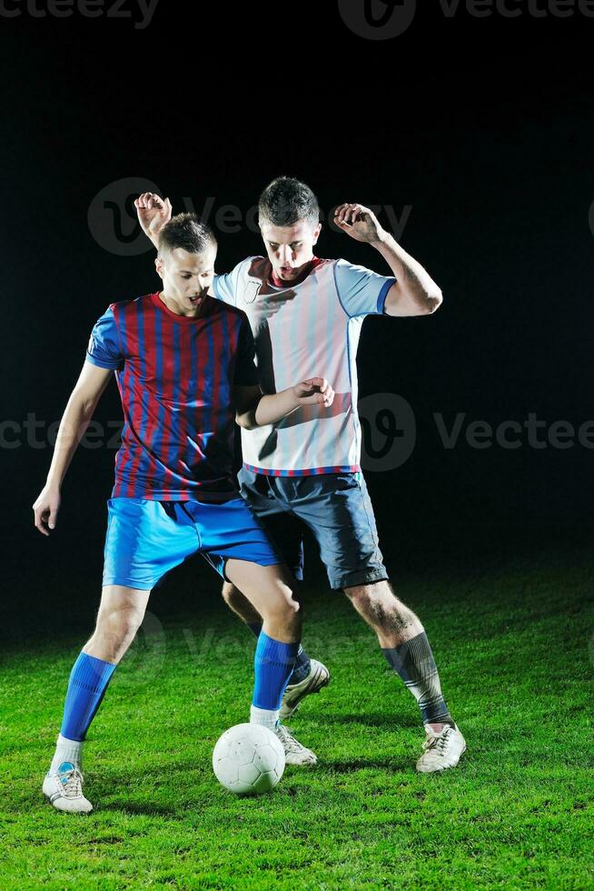 football players in competition for the ball photo