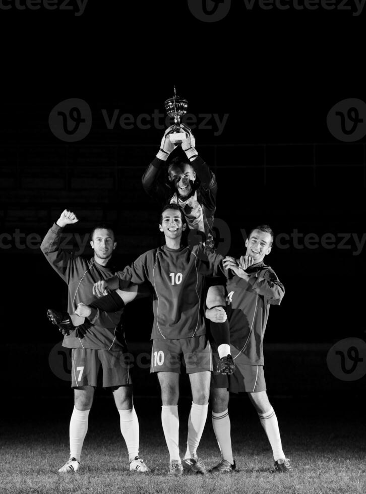 fútbol americano jugadores celebrando el victoria foto