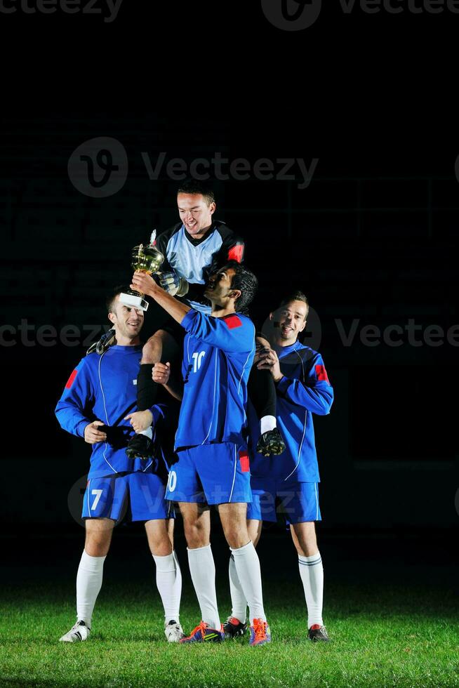 football players celebrating the victory photo