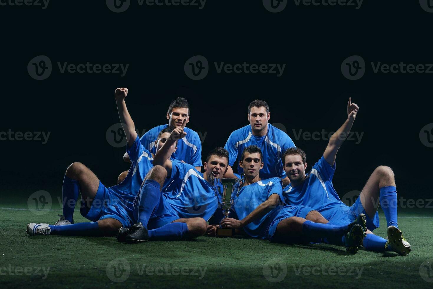 soccer players celebrating victory photo