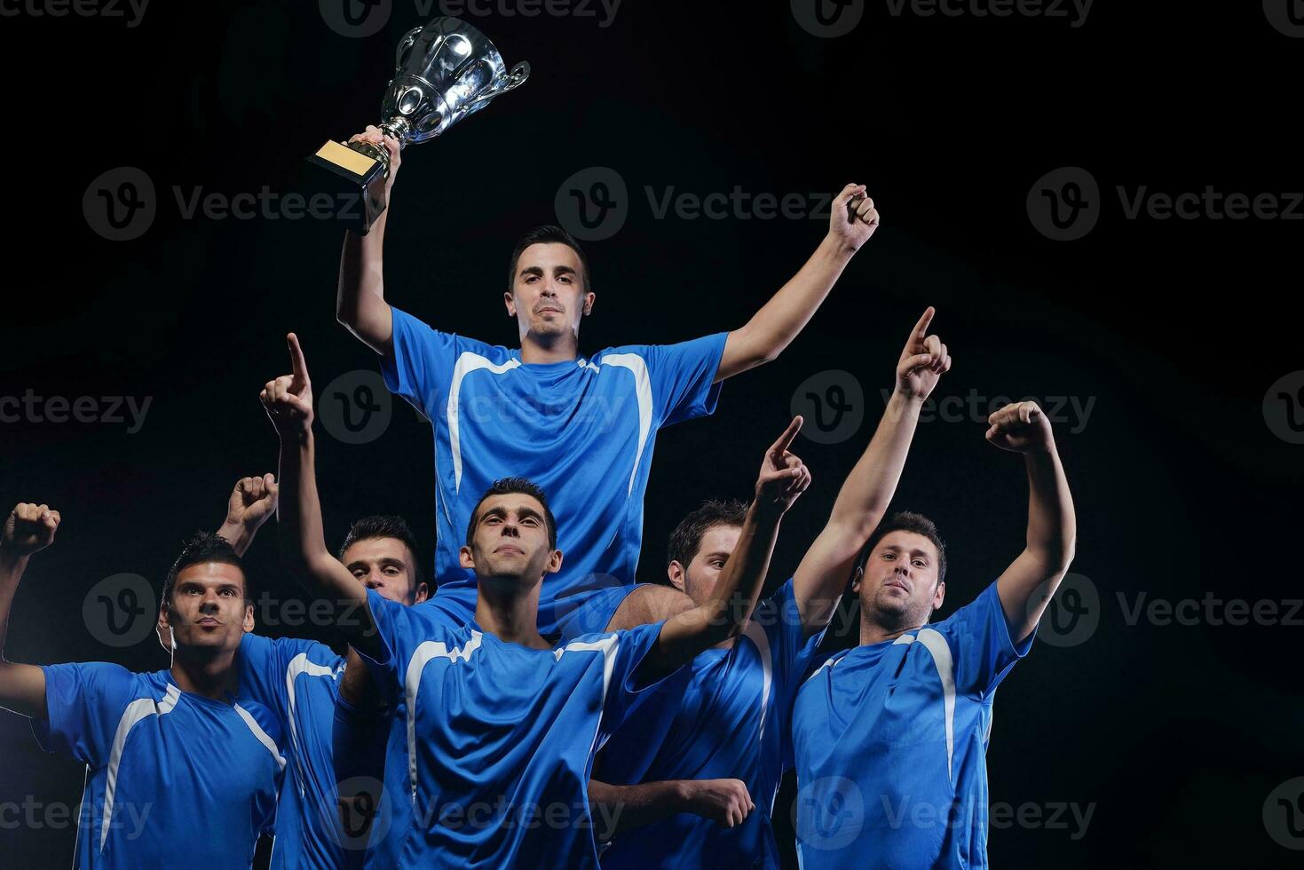 soccer players celebrating victory photo