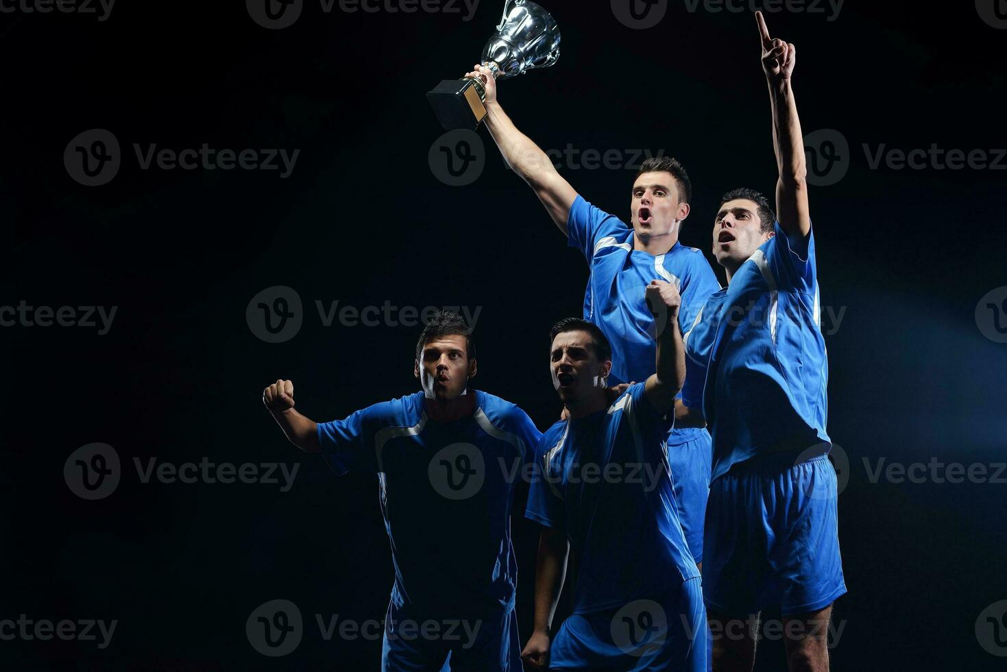 soccer players celebrating victory photo