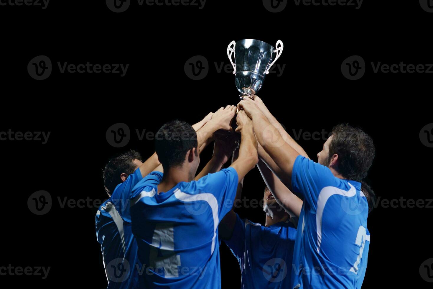 soccer players celebrating victory photo