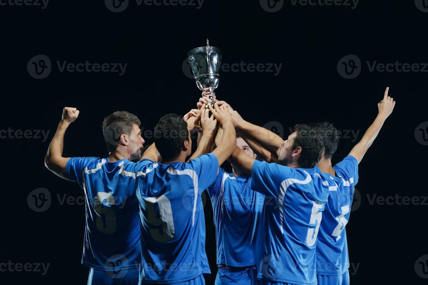 soccer players celebrating victory photo