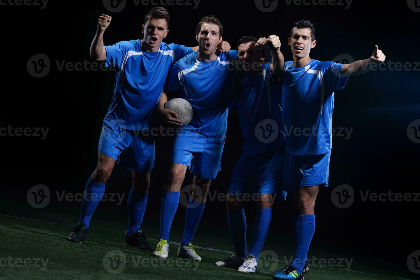 soccer players celebrating victory photo