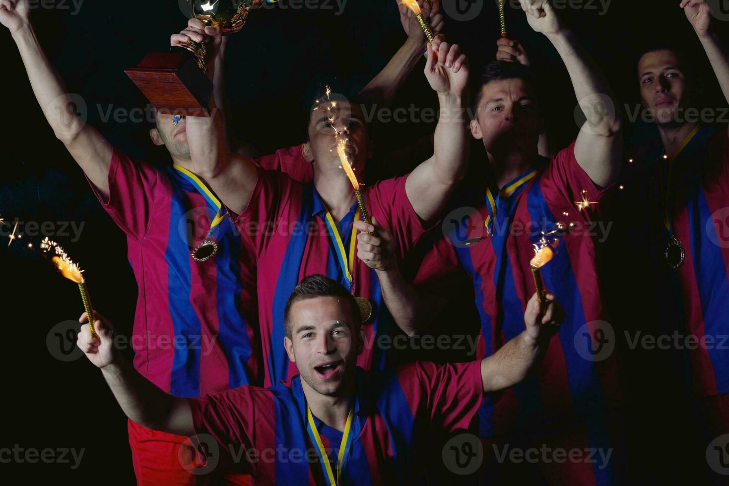 soccer players celebrating victory photo