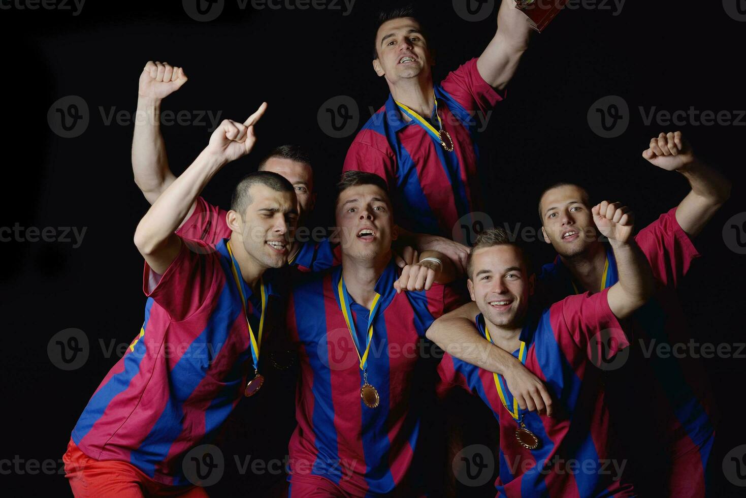 soccer players celebrating victory photo