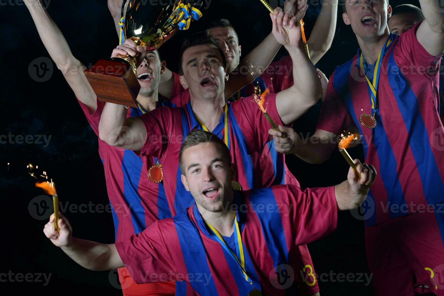soccer players celebrating victory photo