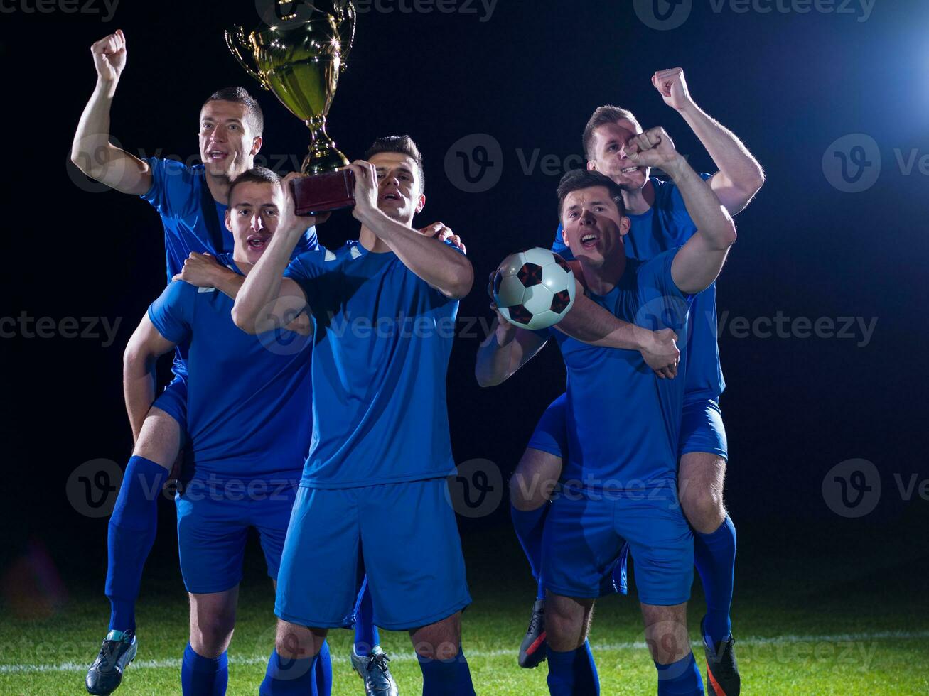 soccer players celebrating victory photo