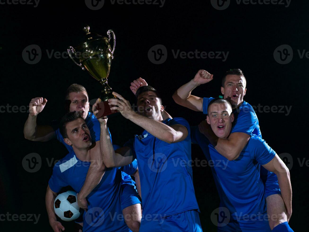 soccer players celebrating victory photo