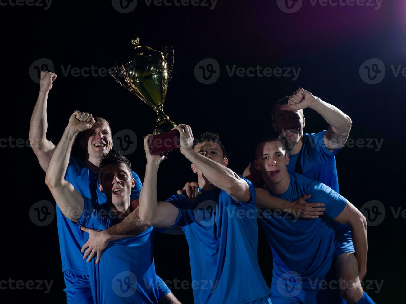 soccer players celebrating victory photo