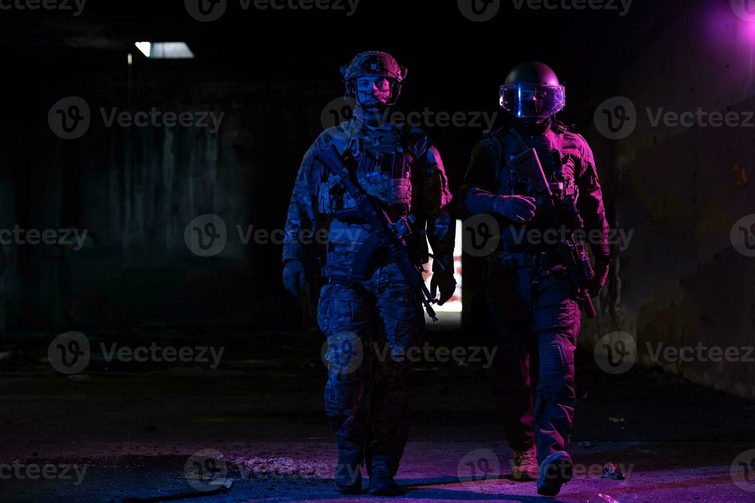 Modern warfare soldiers in dark with combat ammunition and weapons in the hands of equipped laser sights are in battle order. Mixed media. photo