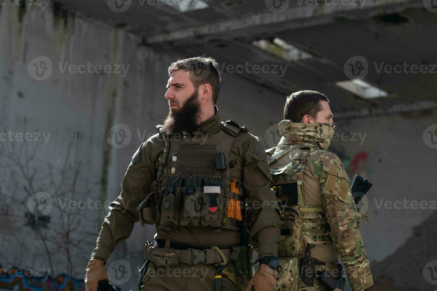 Modern warfare soldiers in dark with combat ammunition and weapons in the hands of equipped laser sights are in battle order. Mixed media. photo