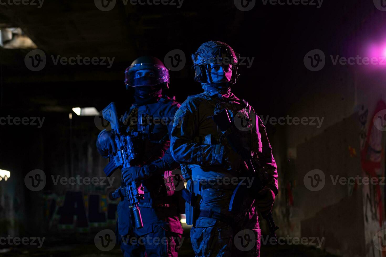 Modern warfare soldiers in dark with combat ammunition and weapons in the hands of equipped laser sights are in battle order. Mixed media. photo