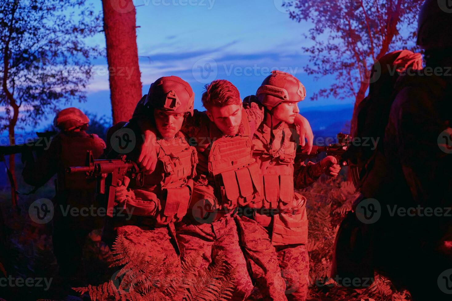 military squad in action rescue wounded soldier 31053198 Stock Photo at