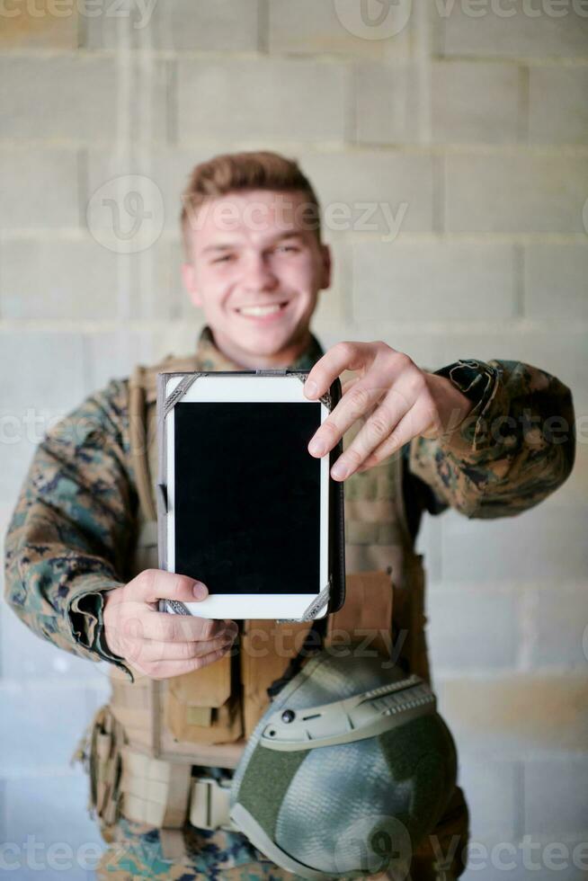 soldier using tablet computer photo