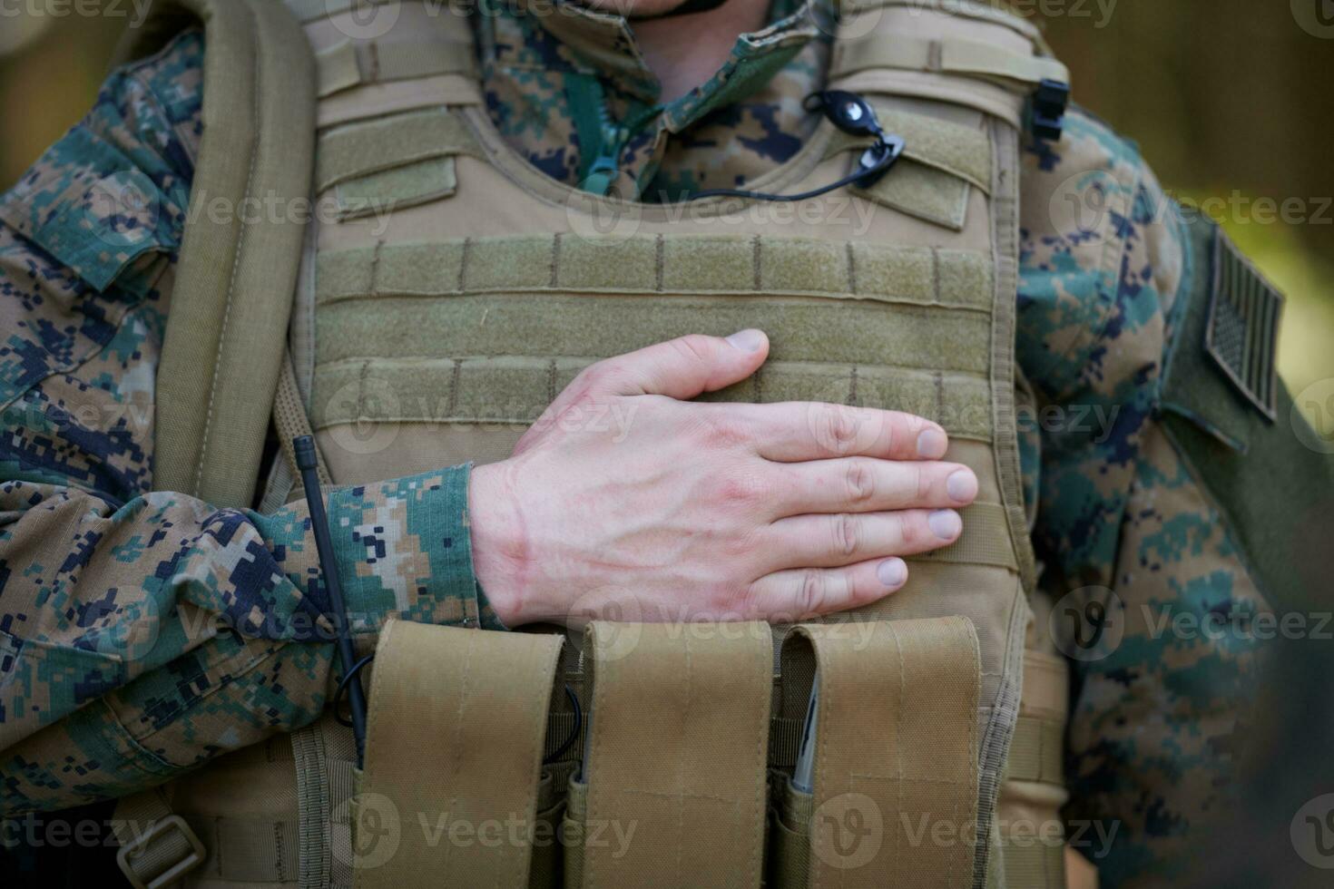 soldier swear with hand on heart photo